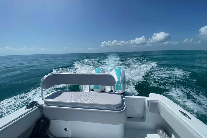 El Viaje Yacht Photos Pics 2023 Andros Offshore 32 boat cruising on open sea under clear blue sky.