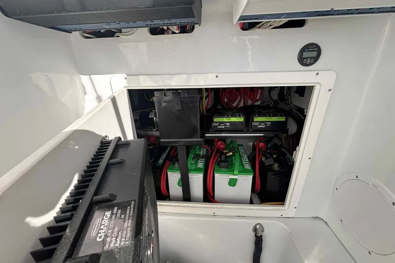 El Viaje Yacht Photos Pics 2023 Andros Offshore 32 boat battery compartment with multiple batteries and wiring.