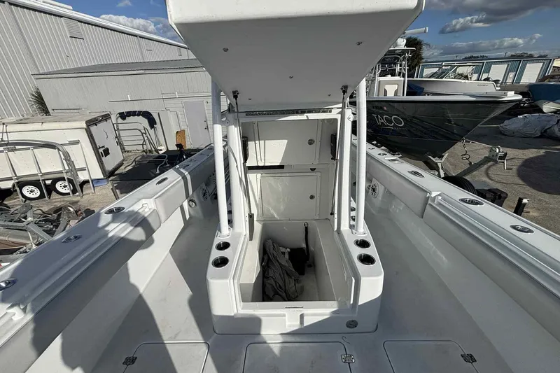 El Viaje Yacht Photos Pics 2023 Andros Offshore 32 boat interior with open storage compartment, docked outdoors.