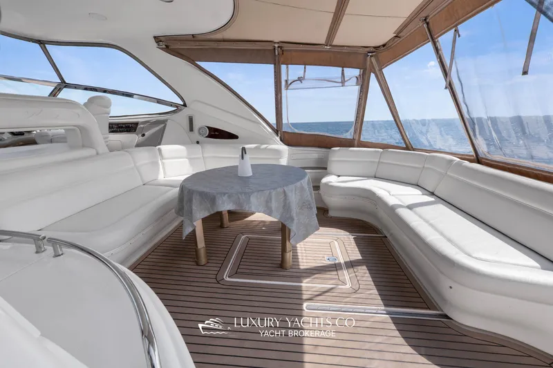  Yacht Photos Pics Luxurious 1999 Sea Ray Sundancer 540 yacht interior with elegant seating and ocean view.