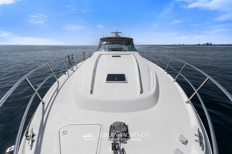  Yacht Photos Pics 1999 Sea Ray Sundancer 540 yacht on open water under clear blue sky.