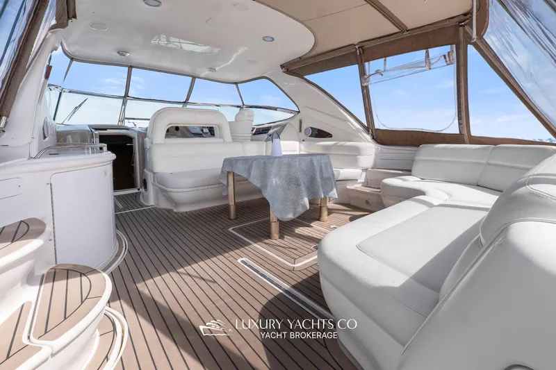  Yacht Photos Pics Luxurious 1999 Sea Ray Sundancer 540 yacht interior with elegant seating and table.