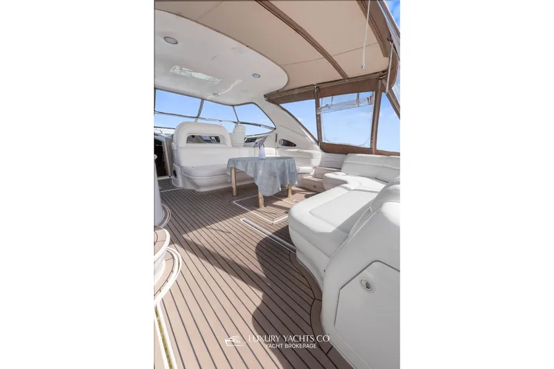  Yacht Photos Pics Luxurious 1999 Sea Ray Sundancer 540 yacht interior with elegant seating and table.