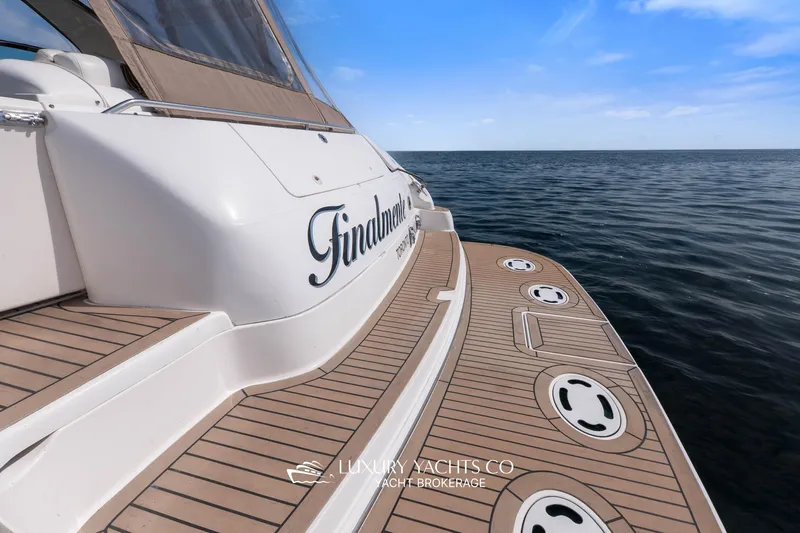  Yacht Photos Pics 1999 Sea Ray Sundancer 540 yacht on calm ocean waters, showcasing elegant deck design.