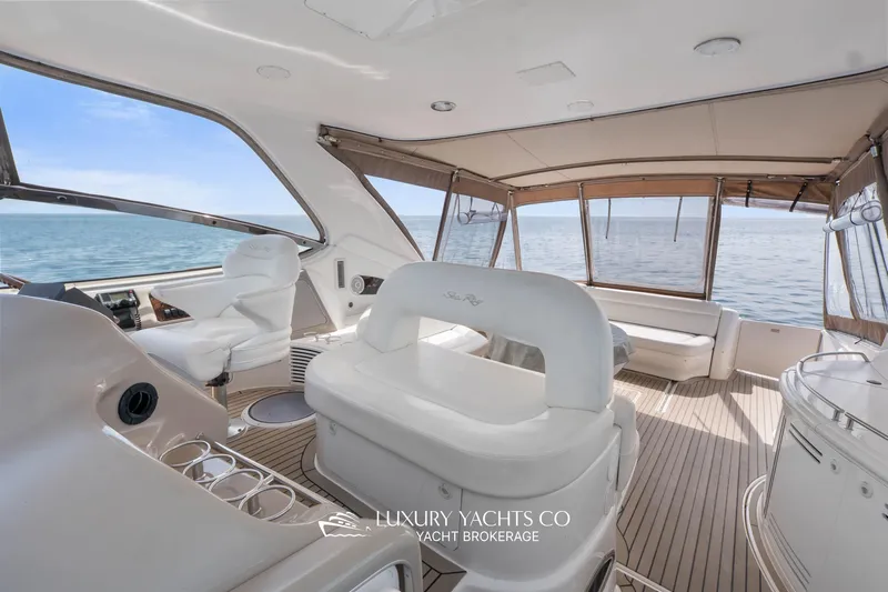  Yacht Photos Pics Luxurious 1999 Sea Ray Sundancer 540 yacht interior with elegant seating and ocean view.