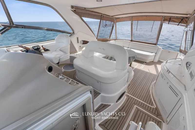  Yacht Photos Pics Luxurious 1999 Sea Ray Sundancer 540 yacht interior with elegant seating and ocean view.