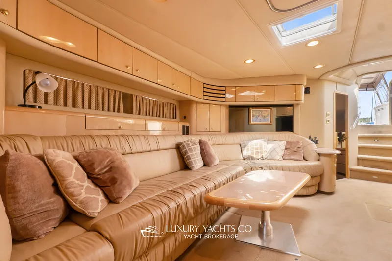  Yacht Photos Pics Luxurious interior of 1999 Sea Ray Sundancer 540 yacht with plush seating and elegant decor.