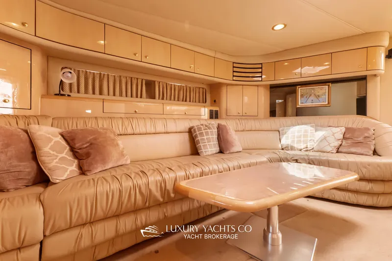 Yacht Photos Pics Luxurious interior of 1999 Sea Ray Sundancer 540 yacht with plush seating and elegant decor.