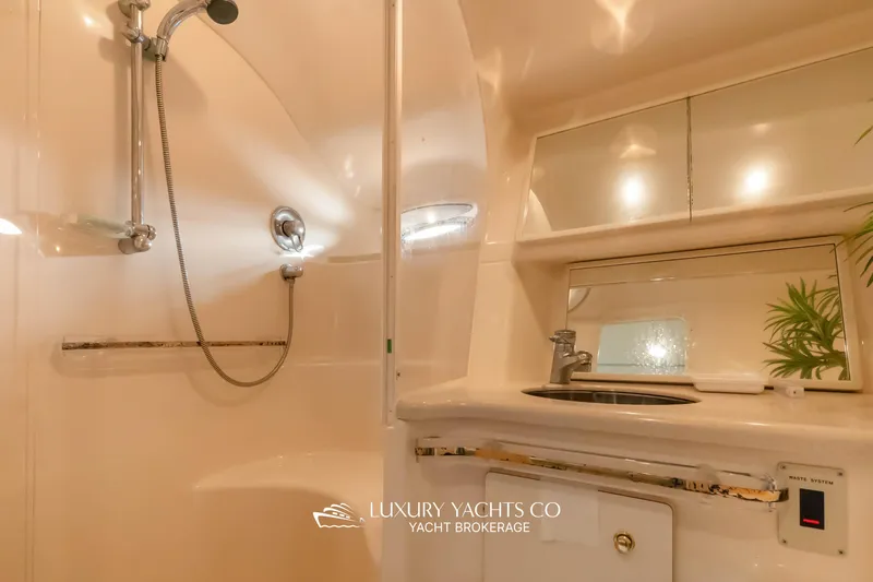  Yacht Photos Pics Bathroom interior of 1999 Sea Ray Sundancer 540 yacht, featuring shower and sink.