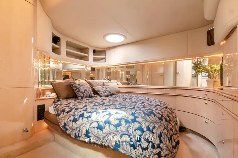  Yacht Photos Pics Luxurious bedroom interior of 1999 Sea Ray Sundancer 540 yacht with elegant bedding.