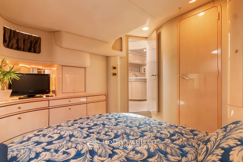  Yacht Photos Pics Luxurious interior of 1999 Sea Ray Sundancer 540 yacht with elegant bedroom and modern amenities.