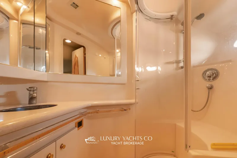  Yacht Photos Pics Luxurious bathroom interior of 1999 Sea Ray Sundancer 540 yacht with modern fixtures.