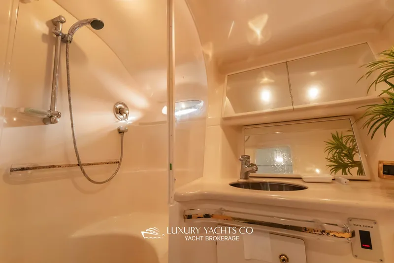  Yacht Photos Pics Luxurious bathroom in 1999 Sea Ray Sundancer 540 yacht with shower and sink.
