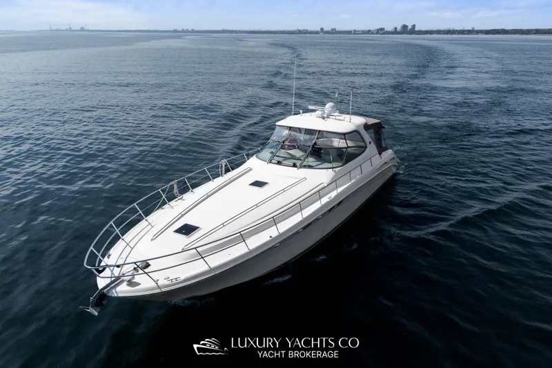  Yacht Photos Pics 1999 Sea Ray Sundancer 540 yacht cruising on open water, clear sky in background.