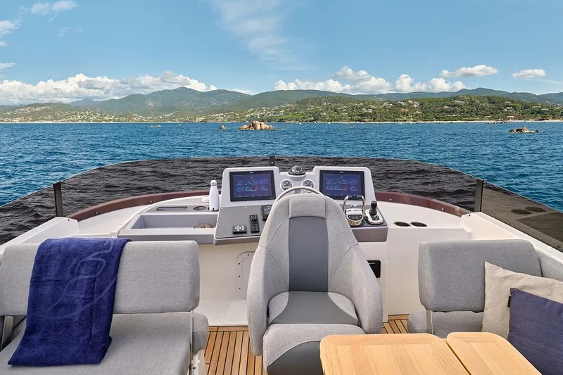  Yacht Photos Pics 2026 Beneteau Swift Trawler 48 helm with ocean view and modern controls.
