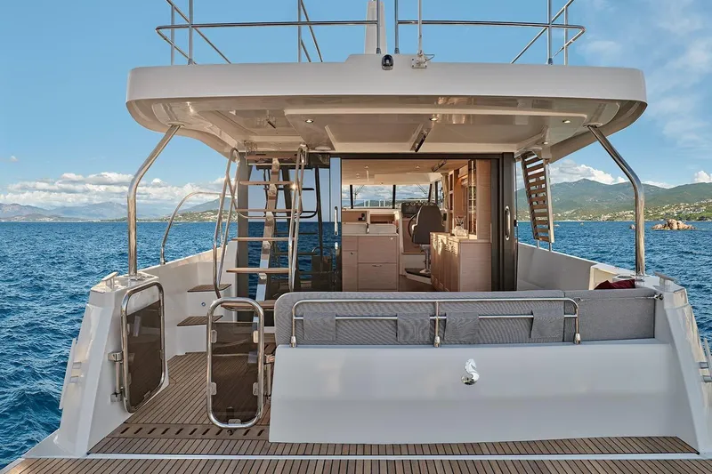  Yacht Photos Pics 2026 Beneteau Swift Trawler 48, rear view, open sea, modern interior design.