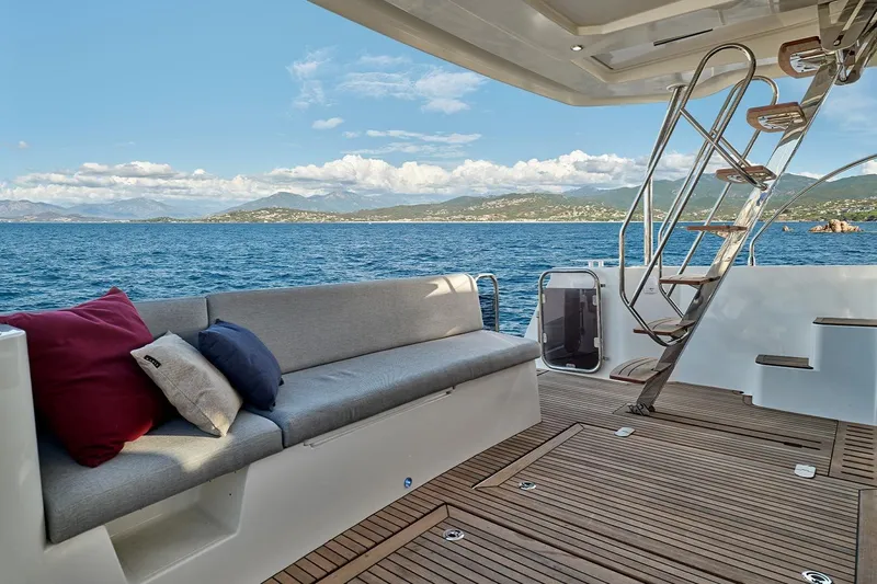  Yacht Photos Pics Luxurious 2026 Beneteau Swift Trawler 48 deck with scenic ocean view and comfortable seating.