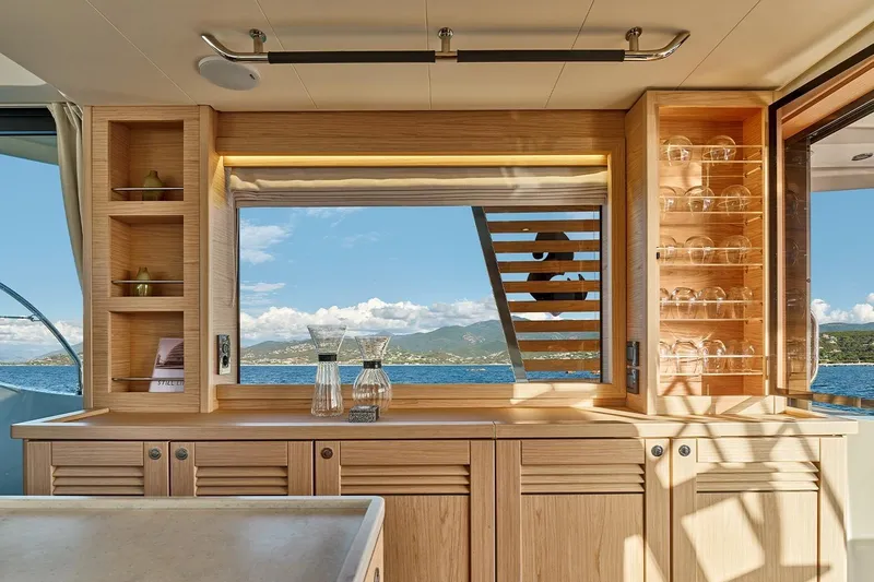  Yacht Photos Pics Interior of 2026 Beneteau Swift Trawler 48 with ocean view through window.