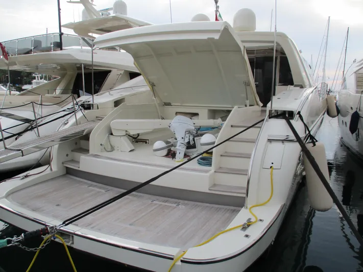 Mr Chic Yacht Photos Pics Luxury yacht Riva 84 Cantata 2001 docked, showcasing open deck and sleek design.