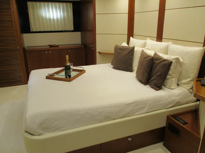 Mr Chic Yacht Photos Pics Luxurious bedroom interior of 2001 Riva 84 Cantata yacht with elegant bedding and champagne.
