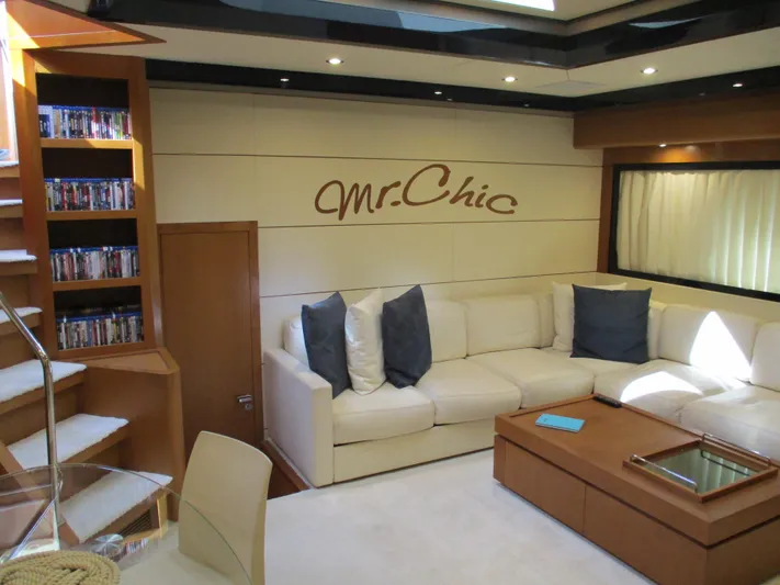 Mr Chic Yacht Photos Pics Luxurious interior of 2001 Riva 84 Cantata yacht with plush seating and elegant decor.