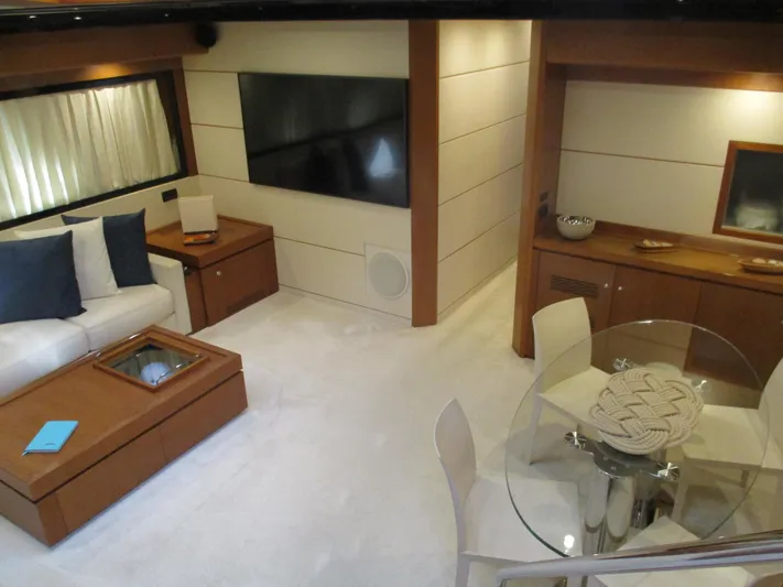 Mr Chic Yacht Photos Pics Luxurious interior of 2001 Riva 84 Cantata yacht with modern furnishings and elegant decor.