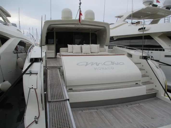 Mr Chic Yacht Photos Pics Luxury yacht Riva 84 Cantata 2001 docked, featuring elegant design and spacious deck.