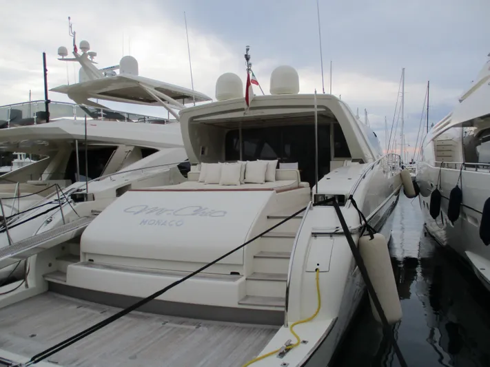 Mr Chic Yacht Photos Pics Luxury yacht Riva 84 Cantata 2001 docked in marina, featuring elegant design and spacious deck.