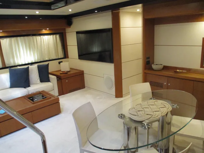 Mr Chic Yacht Photos Pics Luxurious interior of 2001 Riva 84 Cantata yacht with modern furnishings and elegant decor.