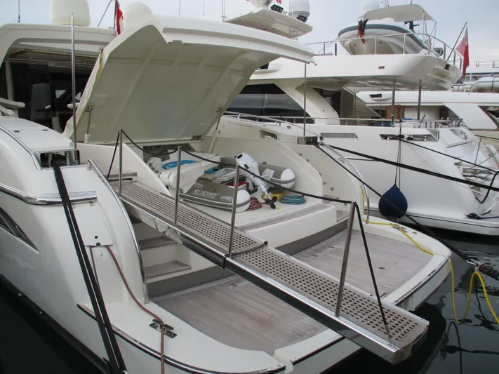 Mr Chic Yacht Photos Pics Luxury yacht Riva 84 Cantata 2001 with open deck and boarding ramp in marina.