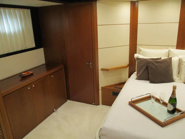 Mr Chic Yacht Photos Pics Luxurious cabin interior of 2001 Riva 84 Cantata yacht with champagne on bed.