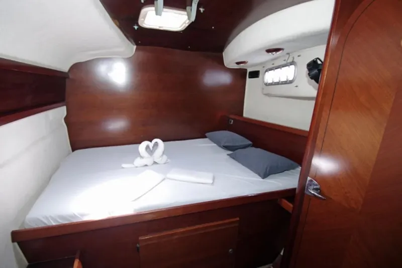  Yacht Photos Pics Luxurious cabin interior of 2004 Fountaine Pajot Bahia 46 catamaran with elegant wood finish.