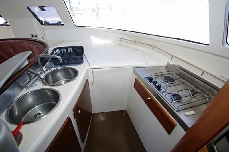  Yacht Photos Pics 2004 Fountaine Pajot Bahia 46 yacht kitchen with dual sinks and gas stove.