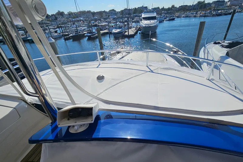 Dream Team Xiii Yacht Photos Pics 2005 Neptunus 56 Flybridge yacht docked at a marina under sunny skies.