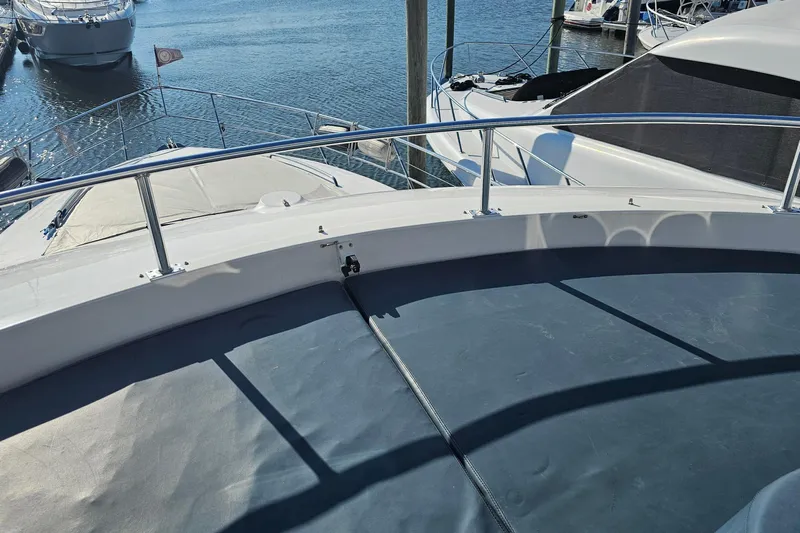 Dream Team Xiii Yacht Photos Pics 2005 Neptunus 56 Flybridge yacht deck view at marina.