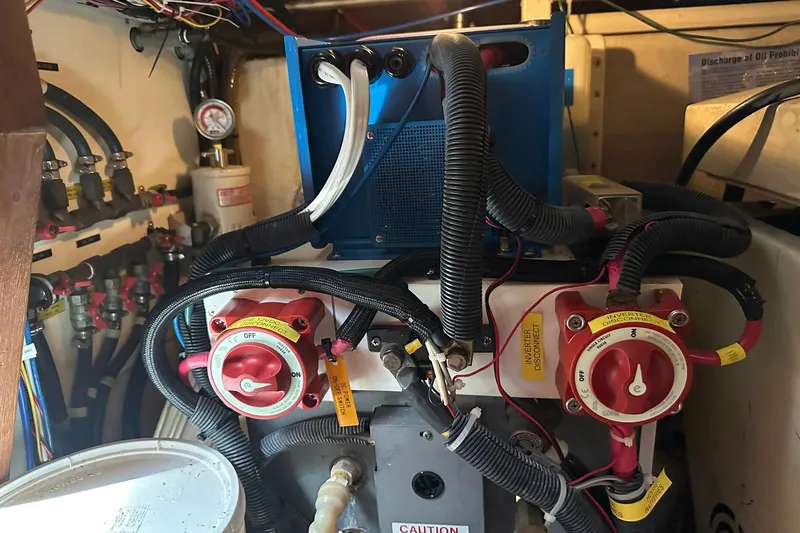 Off Ramp Yacht Photos Pics Engine room of 2002 Novatec Sundeck boat with electrical components and wiring.