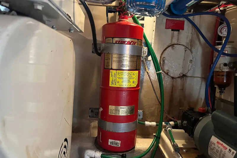 Off Ramp Yacht Photos Pics Engine room of 2002 Novatec Sundeck with fire extinguisher and equipment.