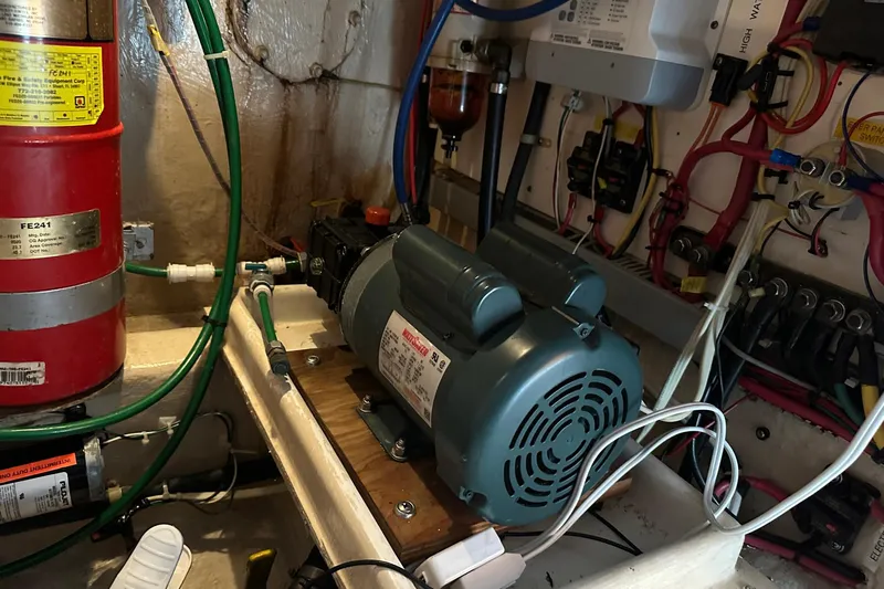 Off Ramp Yacht Photos Pics Engine room of 2002 Novatec Sundeck with machinery and wiring.