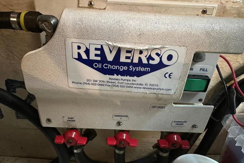 Off Ramp Yacht Photos Pics Reverso oil change system on 2002 Novatec Sundeck boat, featuring control panel and valves.