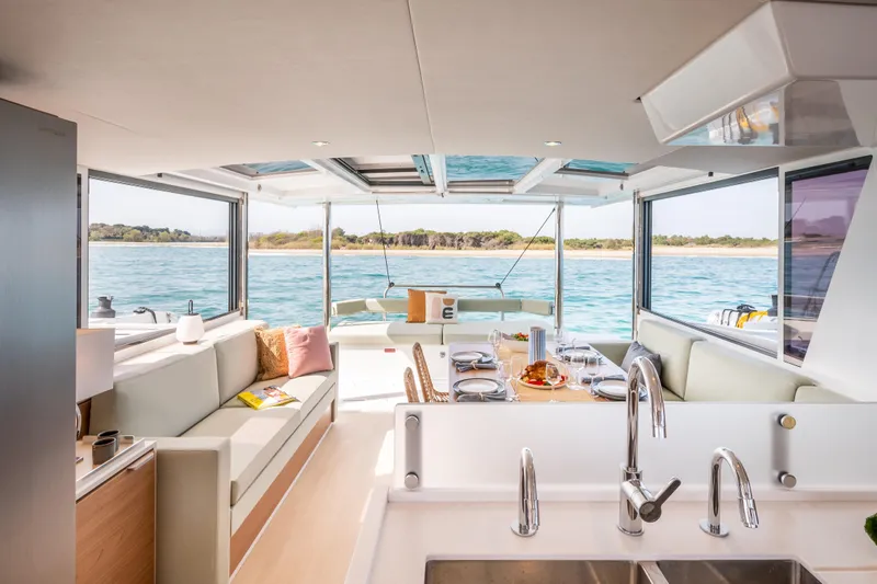  Yacht Photos Pics Luxurious interior of 2026 Bali 4.6 yacht with elegant dining area and scenic ocean view.