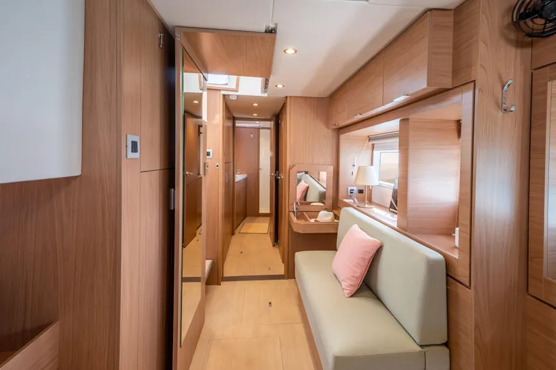  Yacht Photos Pics Luxurious interior of 2026 Bali 4.6 yacht with modern wood finish and cozy seating.