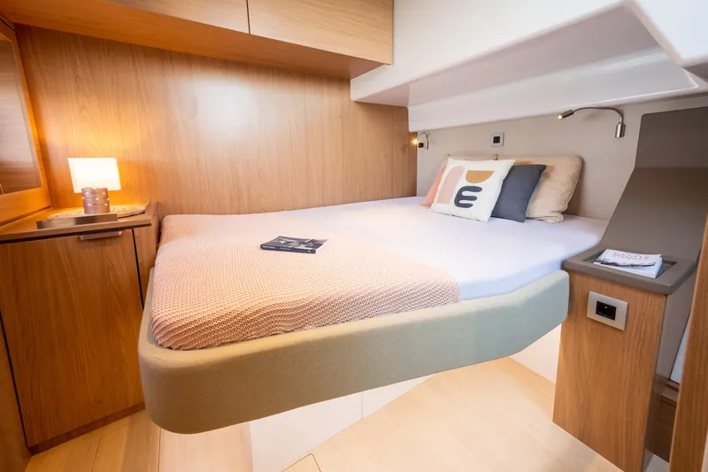  Yacht Photos Pics Modern cabin interior of 2026 Bali 4.6 yacht with cozy bed and ambient lighting.