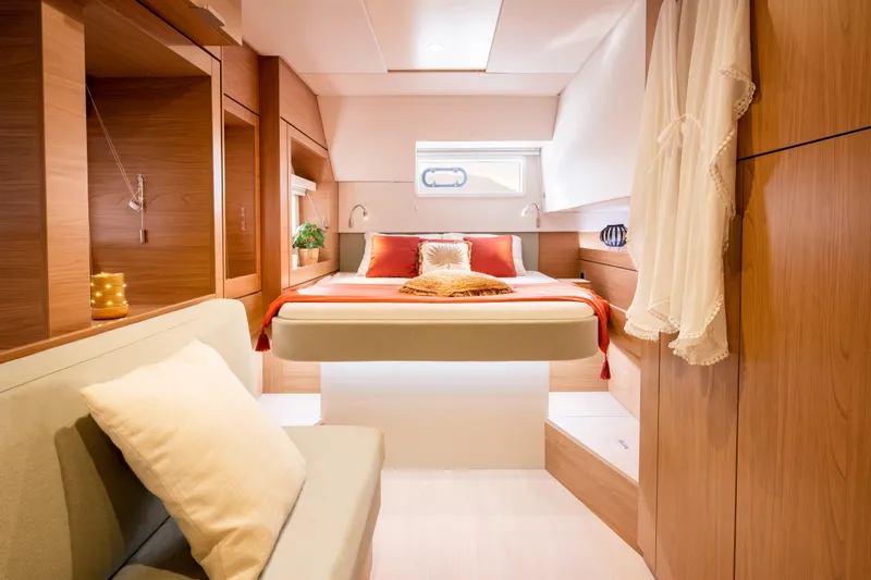  Yacht Photos Pics Luxurious 2026 Bali 4.6 yacht cabin with modern wood interior and cozy bedding.