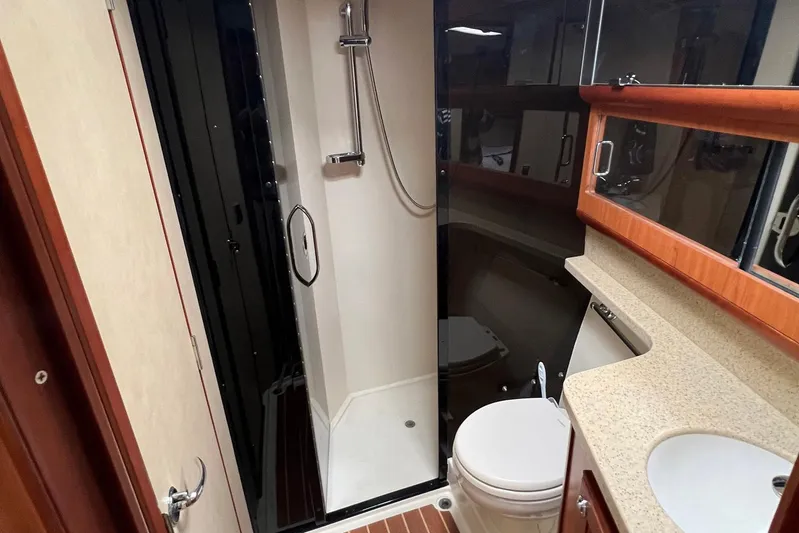 Reel Obsession Yacht Photos Pics 2007 Luhrs 41 Hardtop yacht bathroom with shower, toilet, and sink.