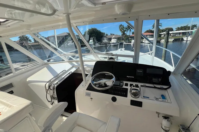 Reel Obsession Yacht Photos Pics 2007 Luhrs 41 Hardtop boat helm with steering wheel and navigation equipment.