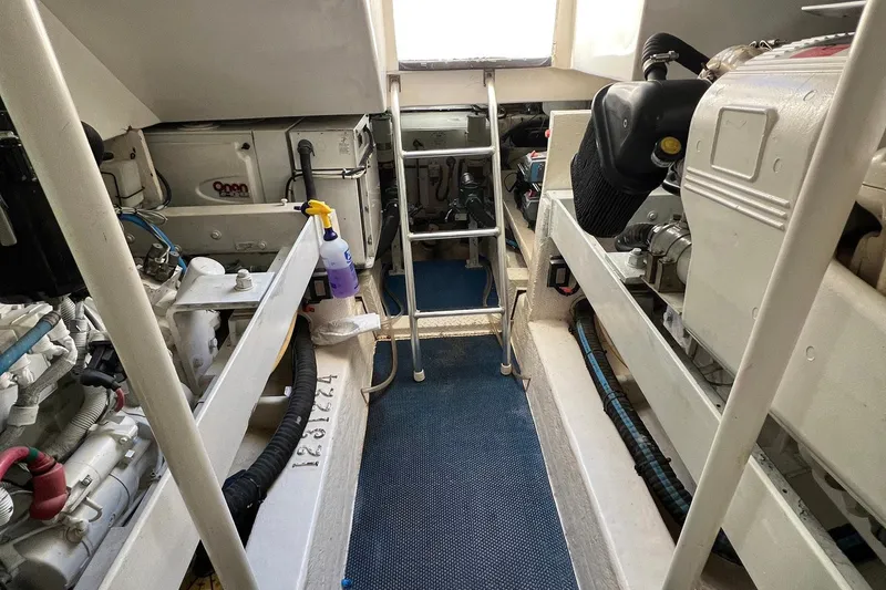 Reel Obsession Yacht Photos Pics Engine room of 2007 Luhrs 41 Hardtop boat with visible machinery and equipment.