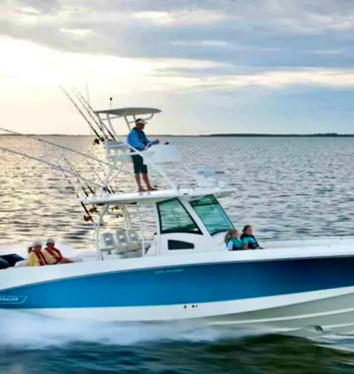 Sea SeÑor Yacht Photos Pics 2017 Boston Whaler 370 Outrage cruising on open water at sunset.