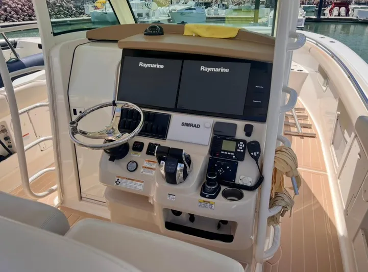 Sea SeÑor Yacht Photos Pics 2017 Boston Whaler 370 Outrage helm with Raymarine displays and Simrad controls.