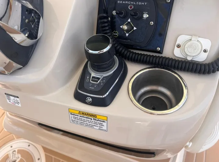Sea SeÑor Yacht Photos Pics Control panel of a 2017 Boston Whaler 370 Outrage boat with joystick and cup holder.