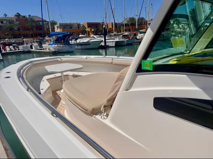 Sea SeÑor Yacht Photos Pics 2017 Boston Whaler 370 Outrage boat docked at marina with seating area.